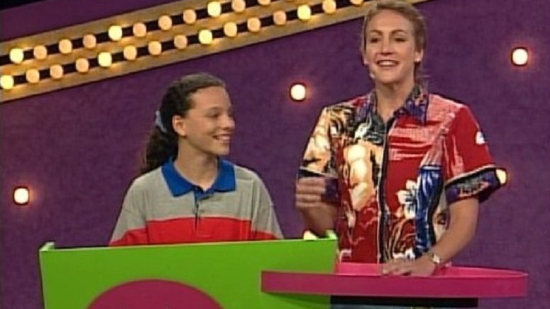 Summer Sanders standing with contestant