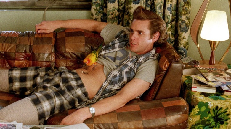 Ace Ventura sits sacked out on a couch in 