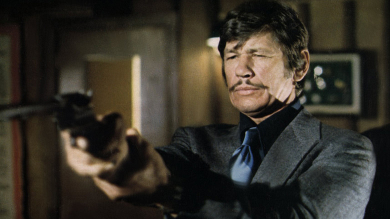 Charles Bronson fires gun