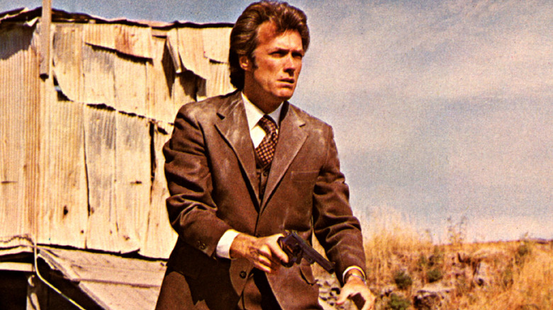 Clint Eastwood holds gun