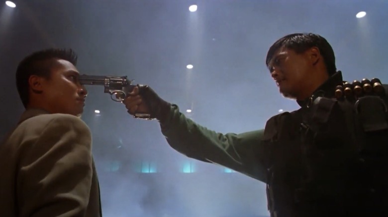 Chow Yun-Fat aims gun