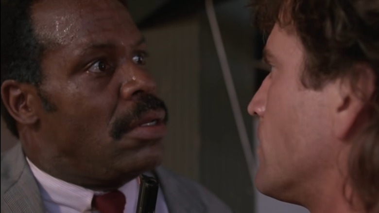 Danny Glover stares at Mel Gibson