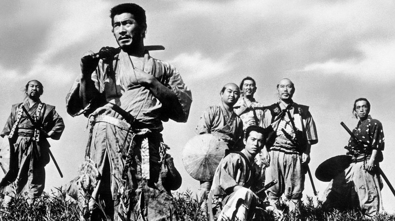 The Seven Samurai stand in a field