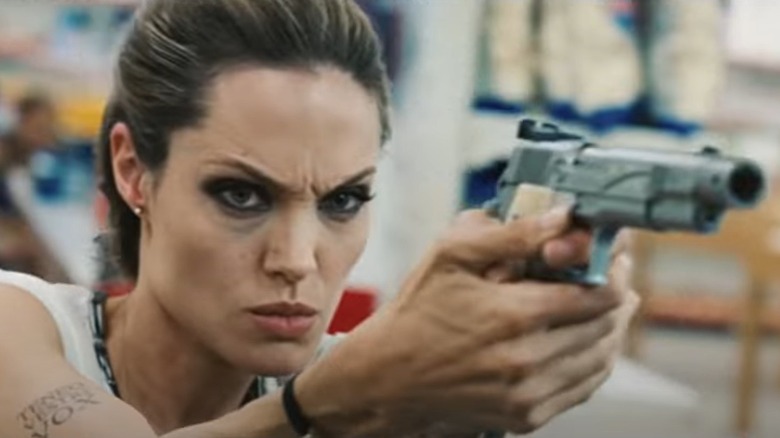 Angelina Jolie fires gun
