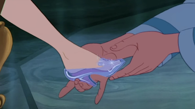 Glass slipper fitting Cinderella's foot