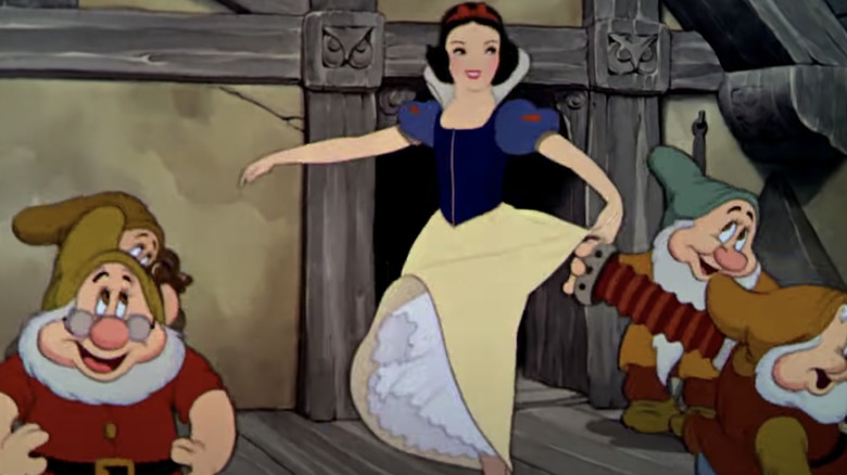 Snow White dances with dwarfs