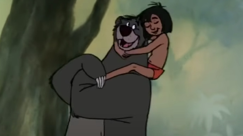 Mowgli and Baloo embrace