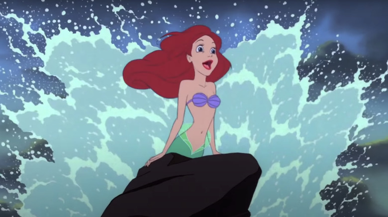 Ariel singing against crashing wave