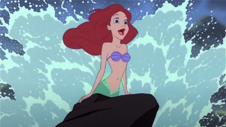 Ariel singing against crashing wave