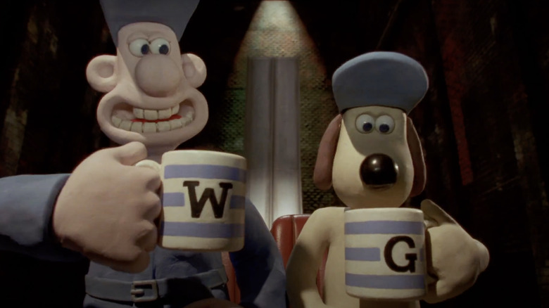 Wallace and Gromit holding mugs