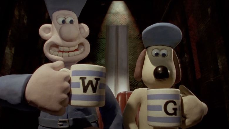 Wallace and Gromit holding mugs