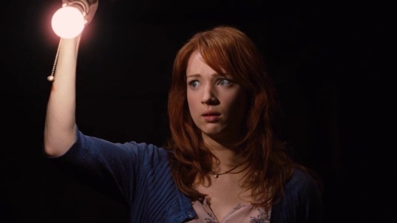 Kristen Connolly holding light