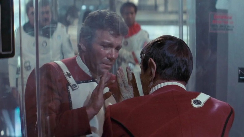 Captain Kirk and Spock with hands on glass