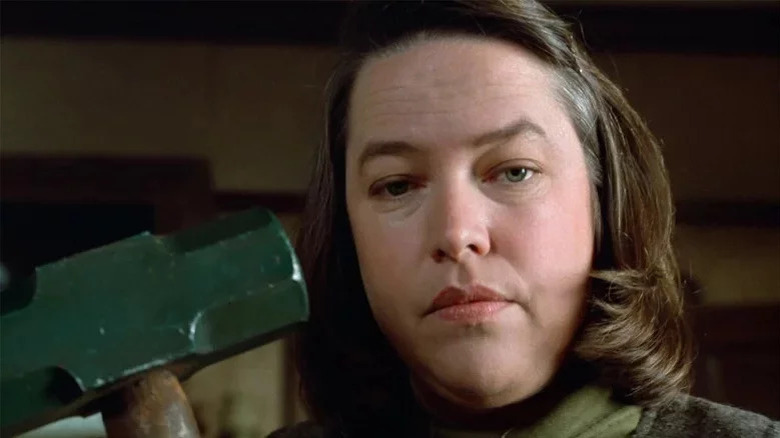 Kathy Bates holds up hammer