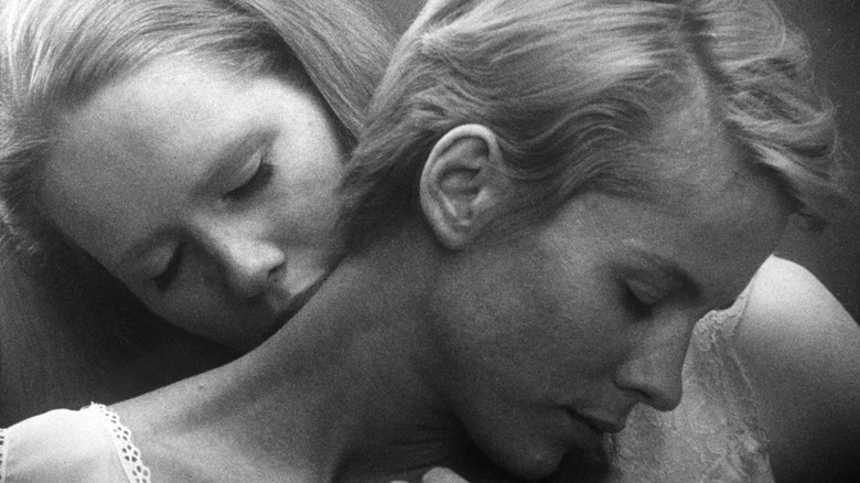 Liv Ullmann kisses Bibi Andersson's neck