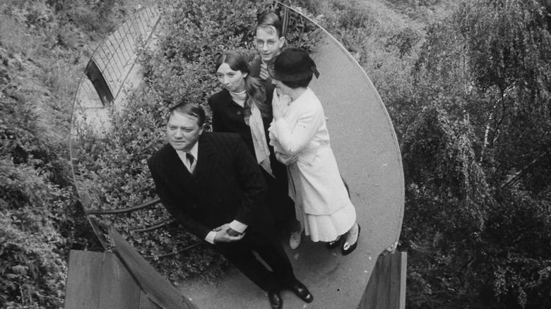 Group of people reflected in mirror