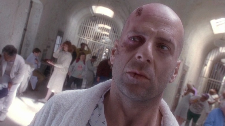 Bruce Willis as James Cole in 12 Monkeys, in a mental institution