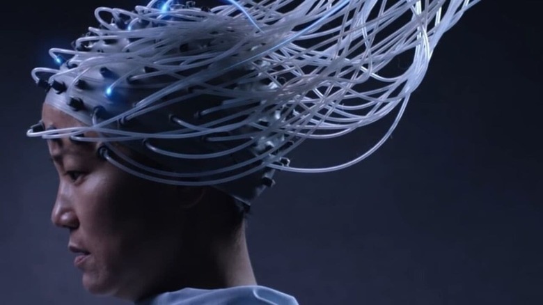 Jacqueline Kim as Gwen wearing a brain-transferring device in Advantageous