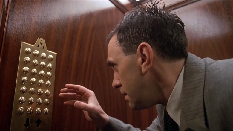 Sam Lowry (Jonathan Pryce) attempts to make sense of an elevator in Brazil