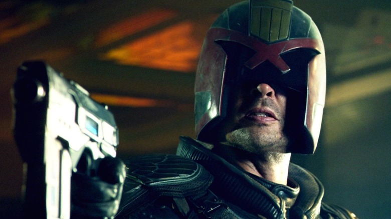 Judge Dredd aiming his pistol