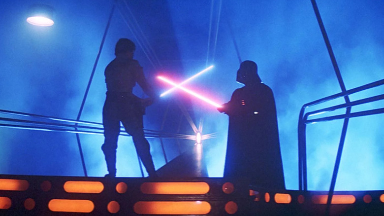 Luke Skywalker and Darth Vader cross lightsabers