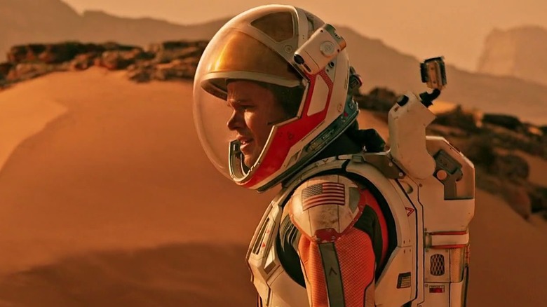 Matt Damon in his spacesuit on Mars as Mark Watney in The Martian