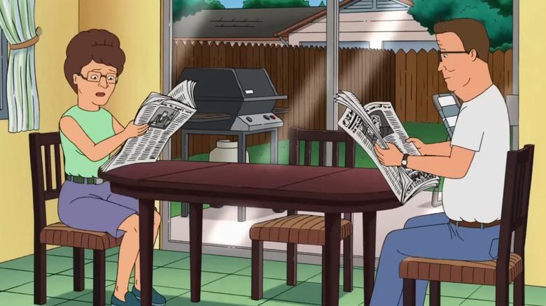 Hank and Peggy reading newspapers