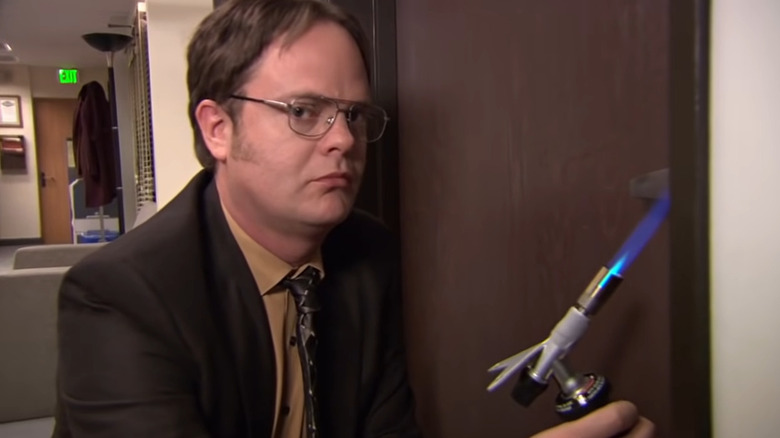 Dwight Schrute blowtorching doorknob