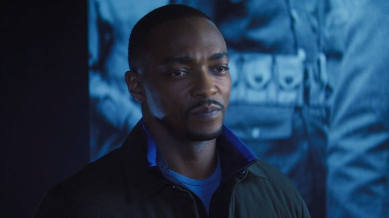 Sam Wilson stood in front of a screen