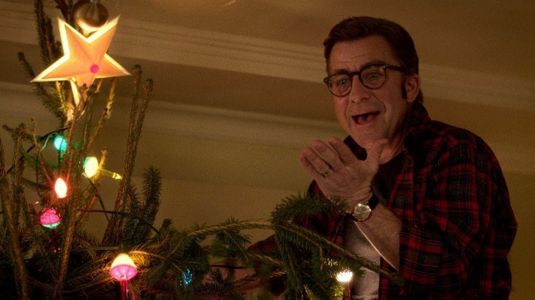 Ralphie putting the star on the tree