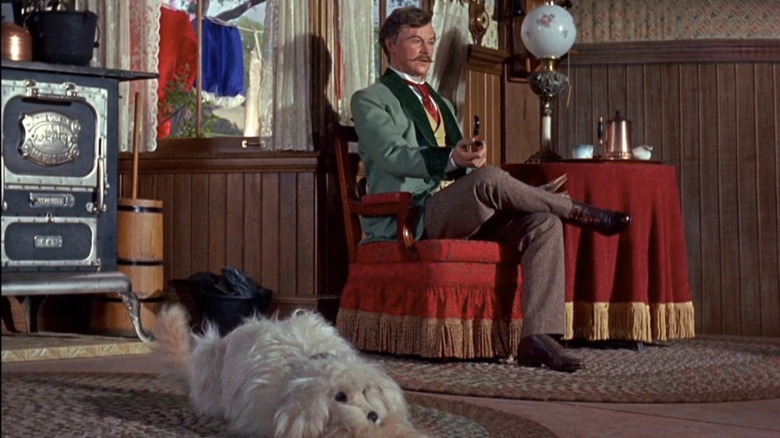 Father sitting with dog in Carousel of Progress