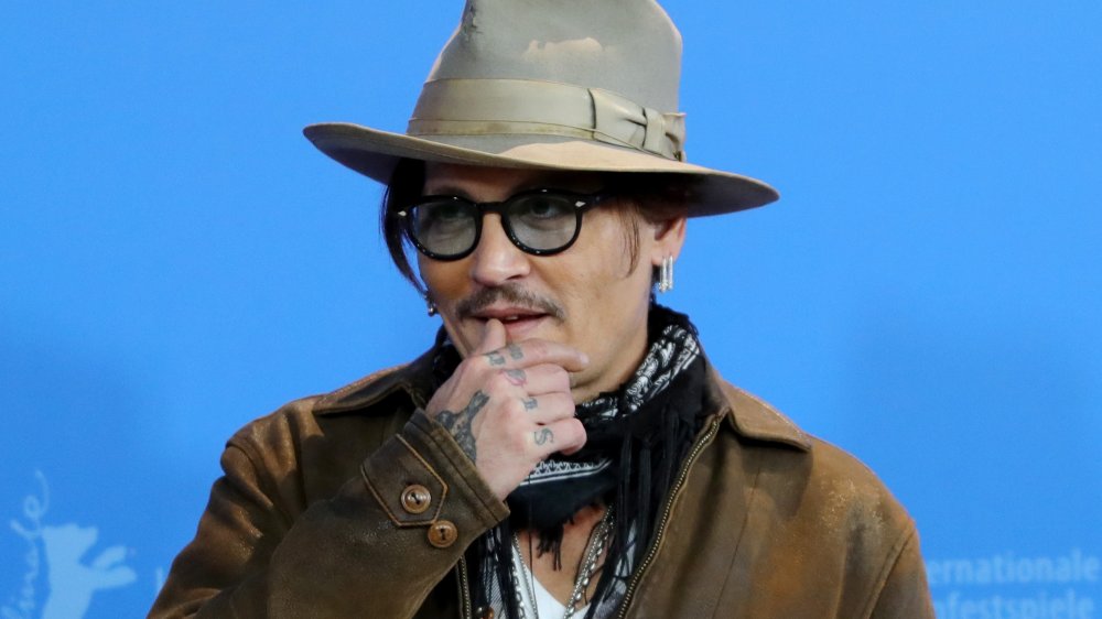 Johnny Depp attends the "Minamata" photo call during the 70th Berlinale International Film Festival Berlin at Grand Hyatt Hotel