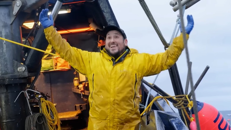 A deckhand on the Saga celebrates after they were able to recover a seemingly lost pot on an episode of Deadliest Catch.