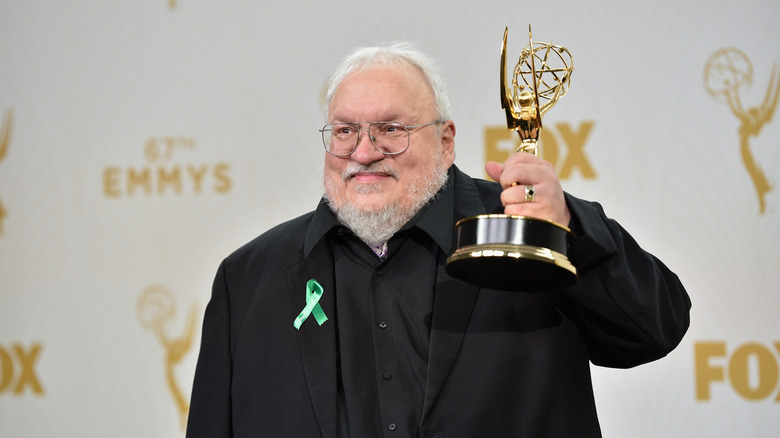 George R.R. Martin holds Emmy