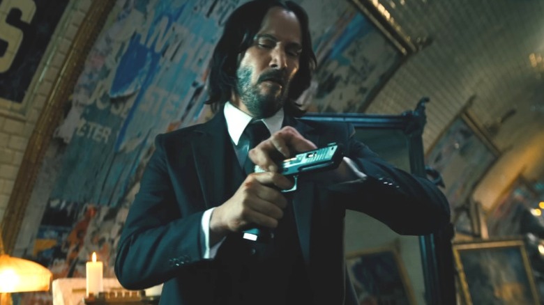 John Wick cocking gun