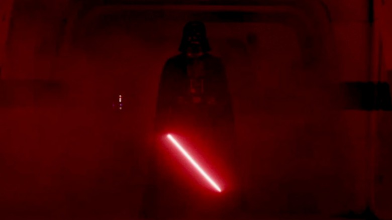 Darth Vader holding his lightsaber