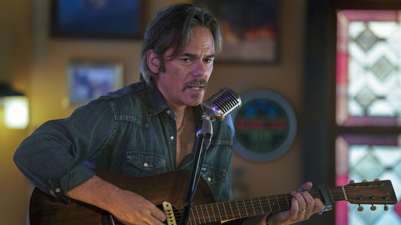 Vince Leone playing guitar and singing in Smokey's in 