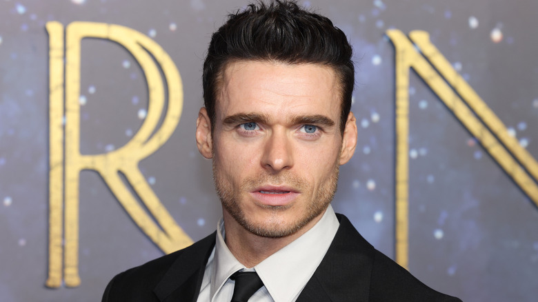 Richard Madden posing for photographers