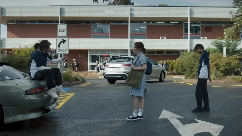 Students talking in a parking lot