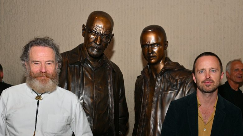 Bryan Cranston and Aaron Paul with statues