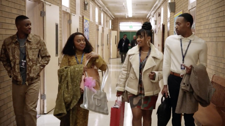 cast walking down hallway 