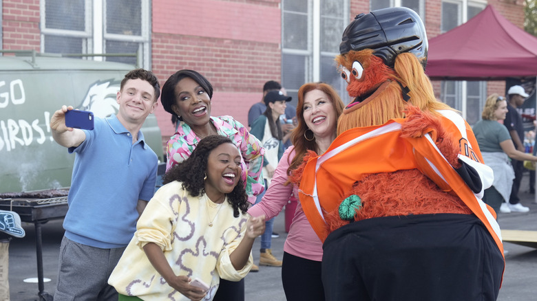 Jacob, Barbara, Janine, and Melissa take a selfie with Gritty