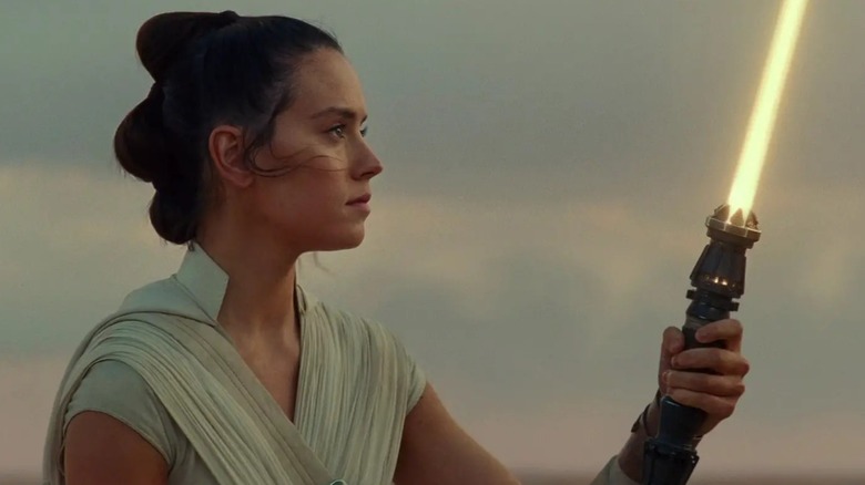 Rey ignites her lightsaber