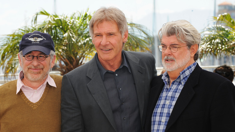 Harrison Ford, George Lucas, and Steven Spielberg at a premiere 