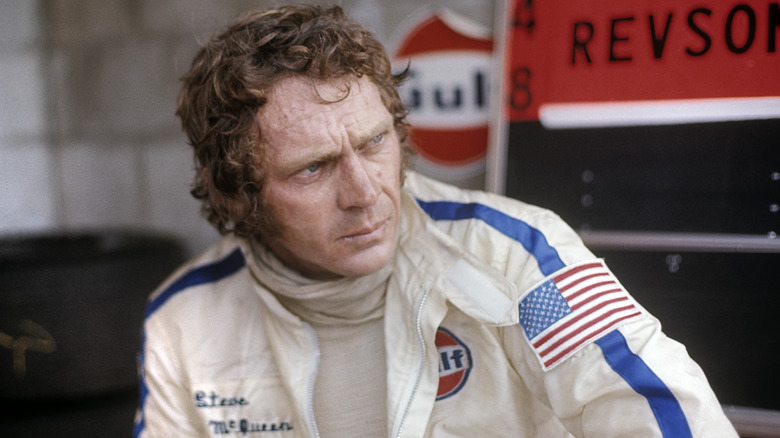 Steve McQueen in racing uniform