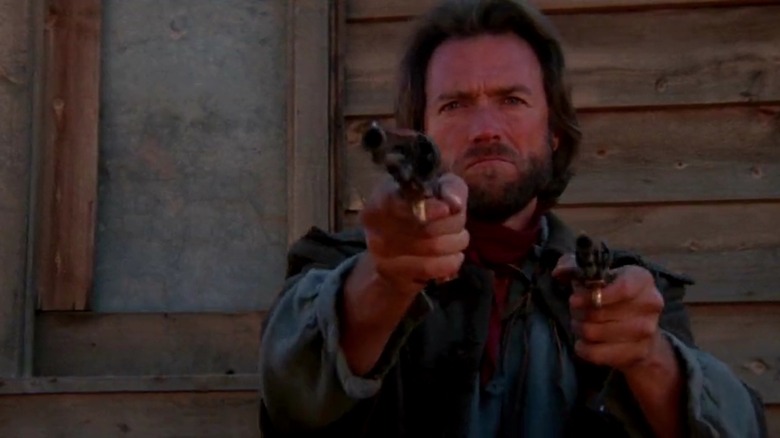 Josey Wales holding two guns