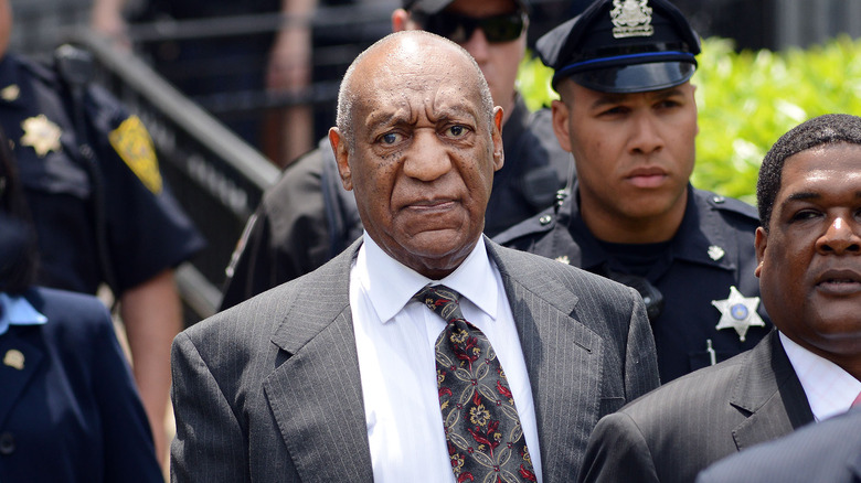 Bill Cosby escorted by police