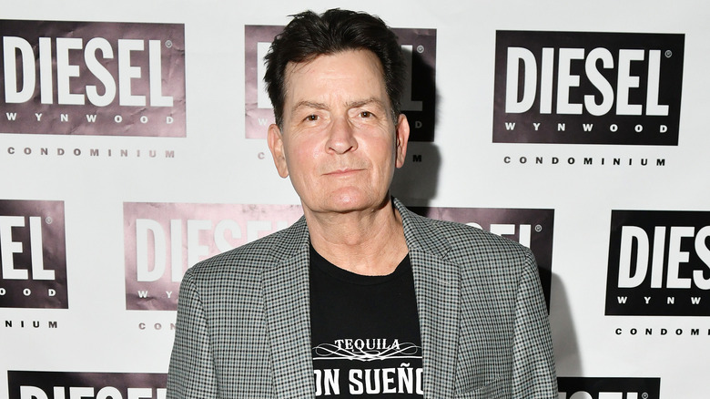 Charlie Sheen wears a jacket