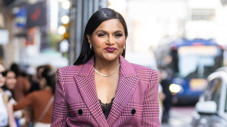 Mindy Kaling walks on a city street