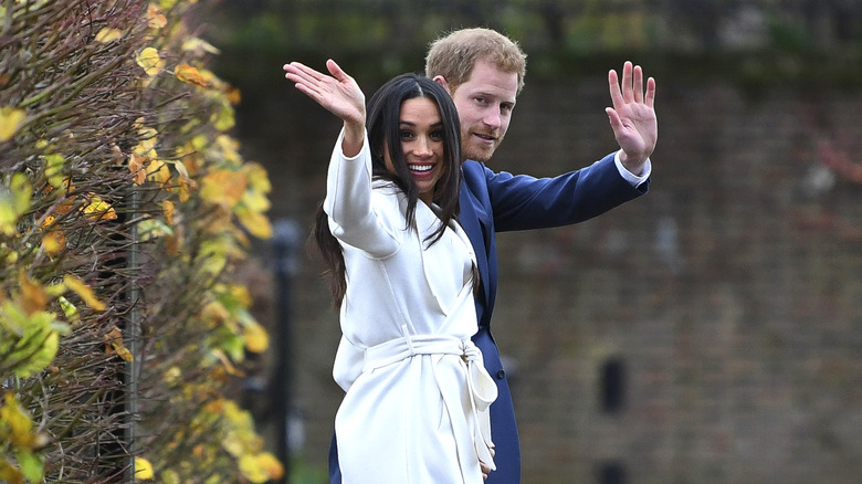 Meghan Markle and Prince Harry waving